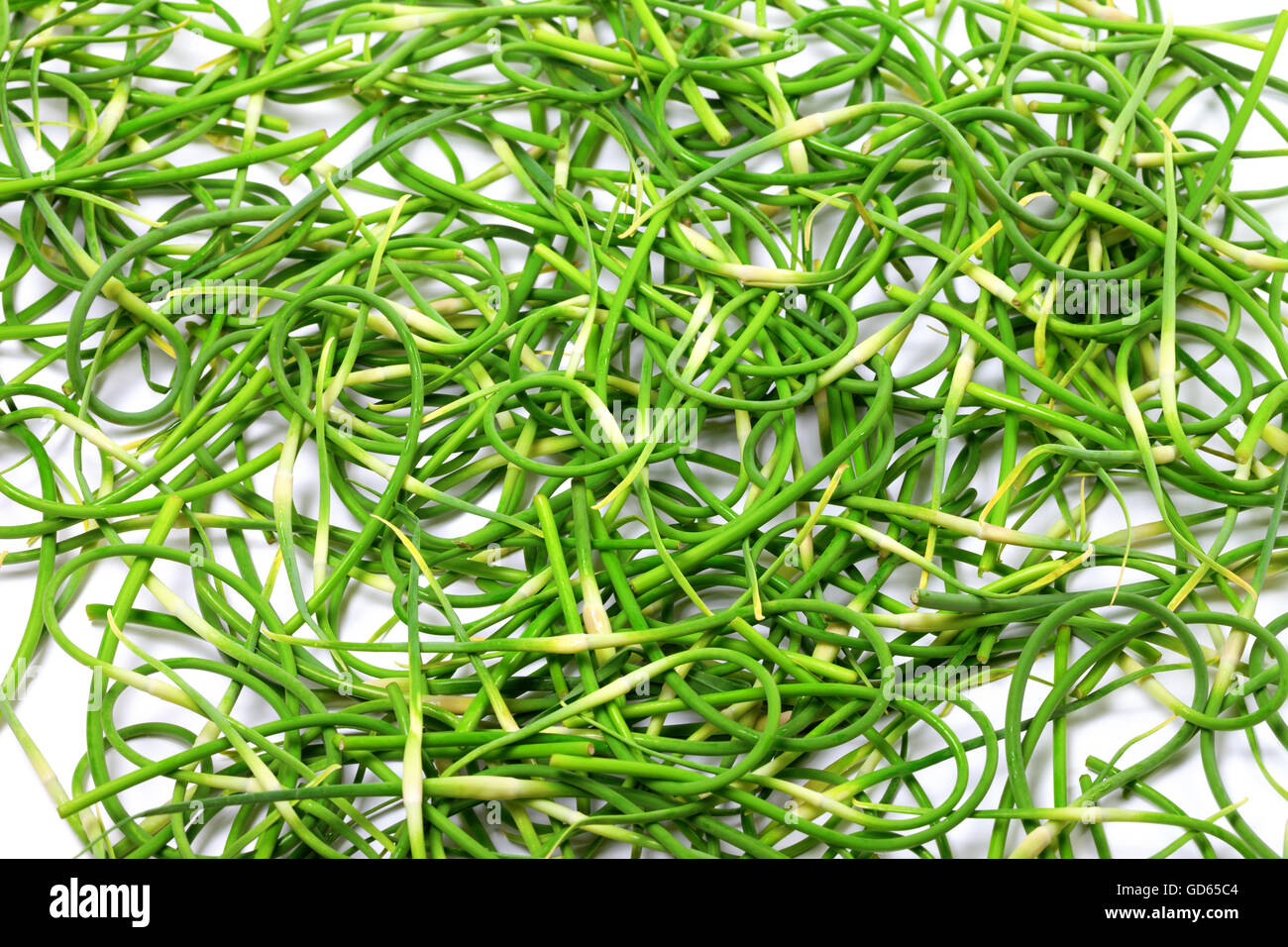 Background of fresh green garlic scape Stock Photo