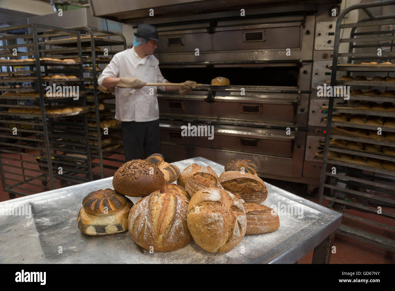 Baker baking bread. England. UK Stock Photo Alamy