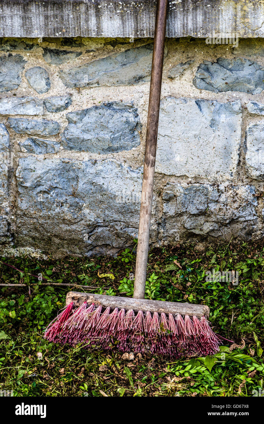 Stiff nylon yard brush in garden Stock Photo Alamy