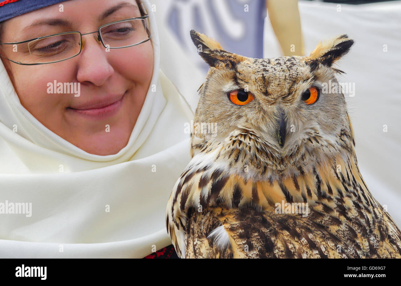 Portrait of a Woman with eagle owl Stock Photo