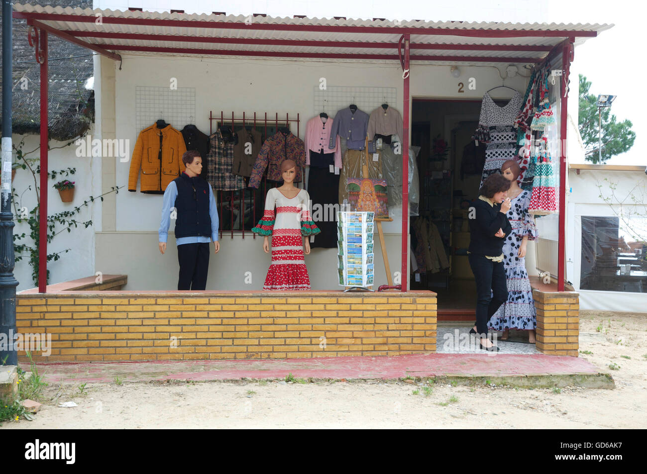 clothes displayed outside simple, unsophisticated clothes shop. Stock Photo