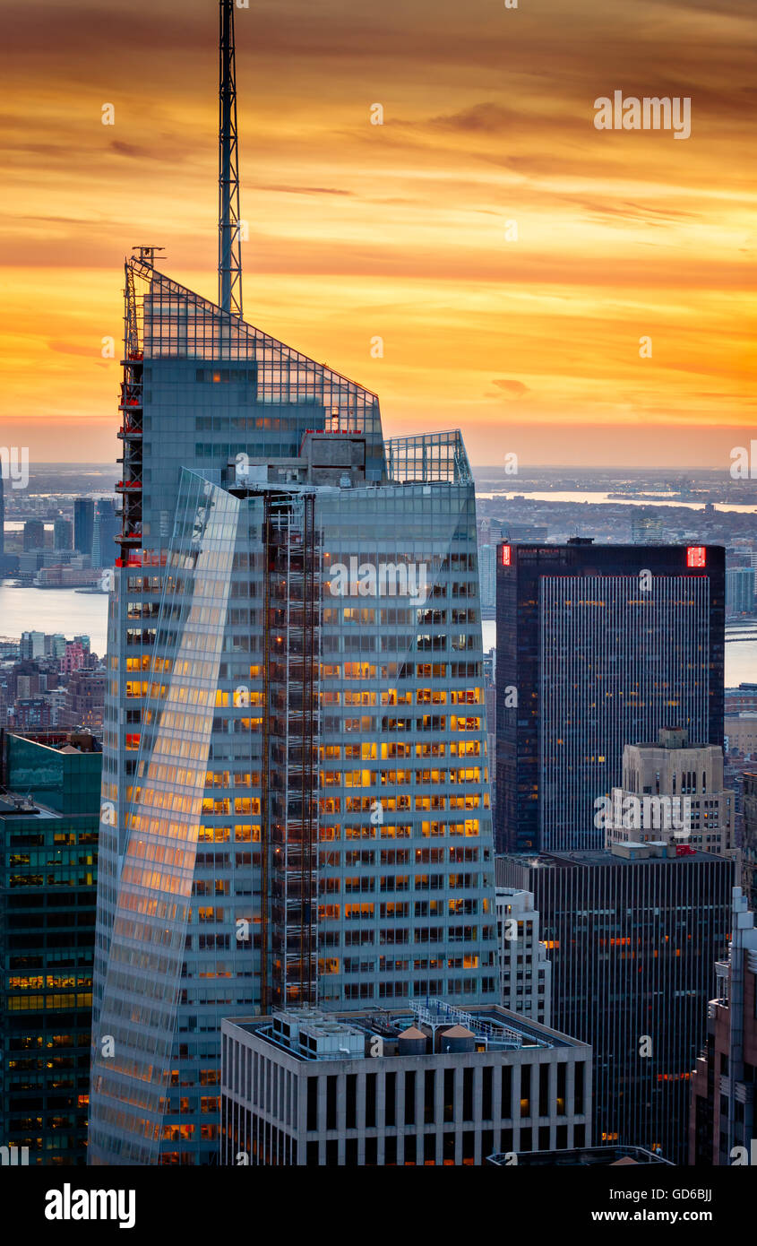 Aerial view of the Bank of America Tower (under construction) and One Penn Plaza at sunset. Midtown Manhattan, New York City Stock Photo