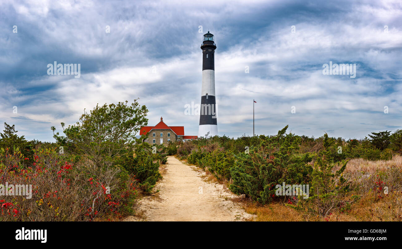 Fire Island Lighthouse with gathering clouds. Great South Bay, Long Island, New York Stock Photo