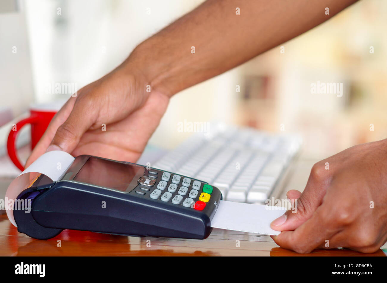 Closeup hands prcessing payment using credit card terminal device ...