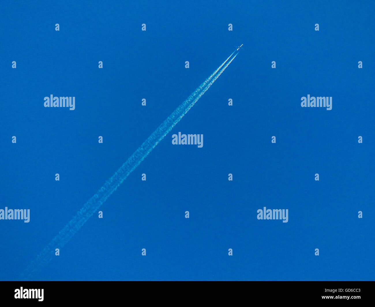 Jet contrails high altitude jet plane Stock Photo Alamy