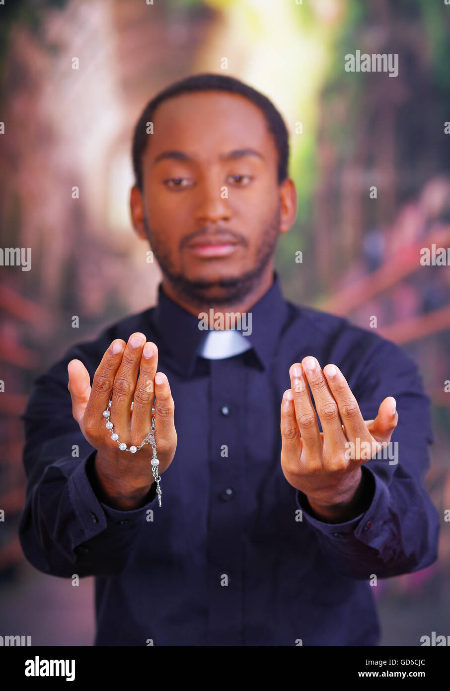 Catholic priest wearing traditional clerical collar shirt standing