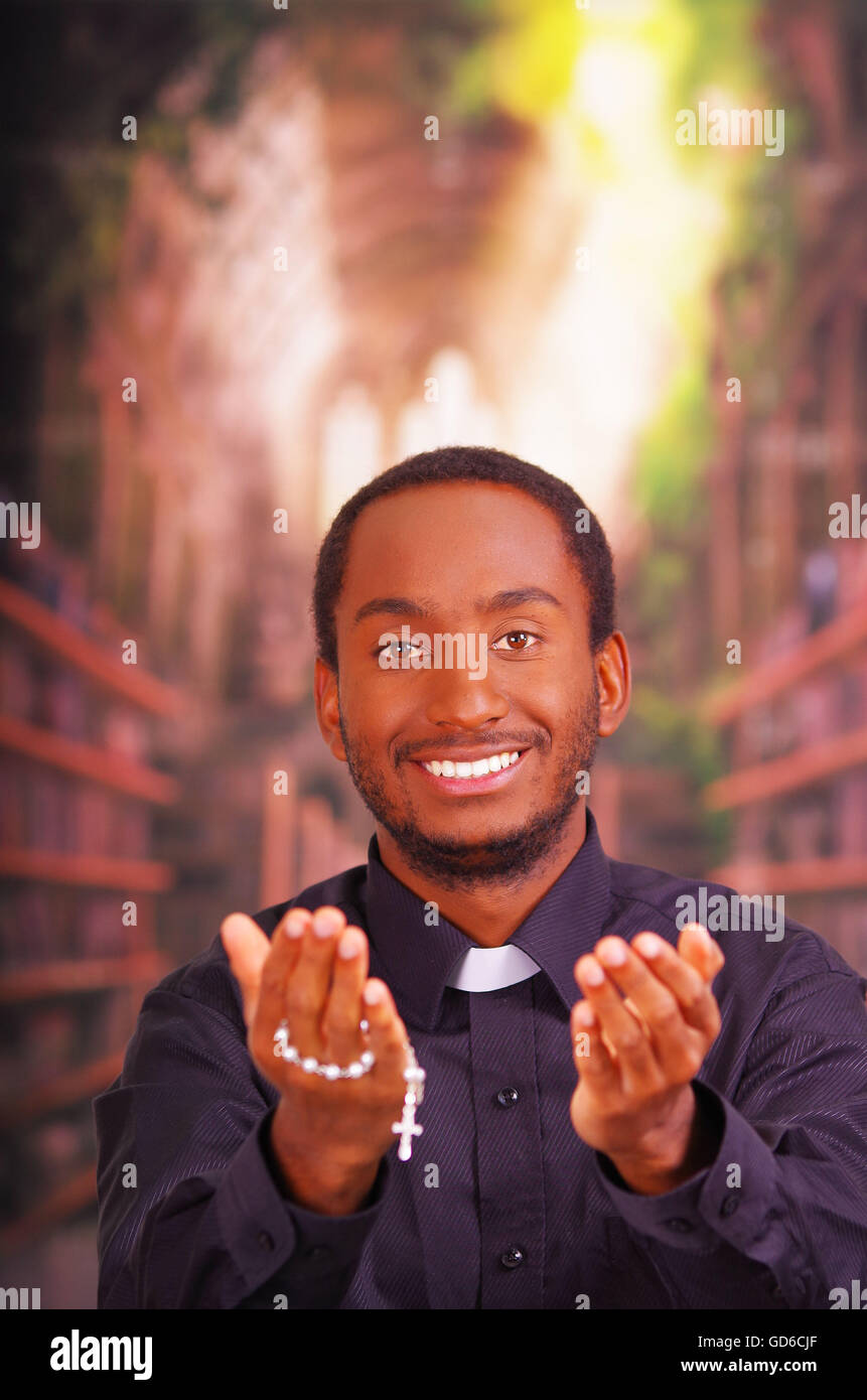 Catholic priest wearing traditional clerical collar shirt standing