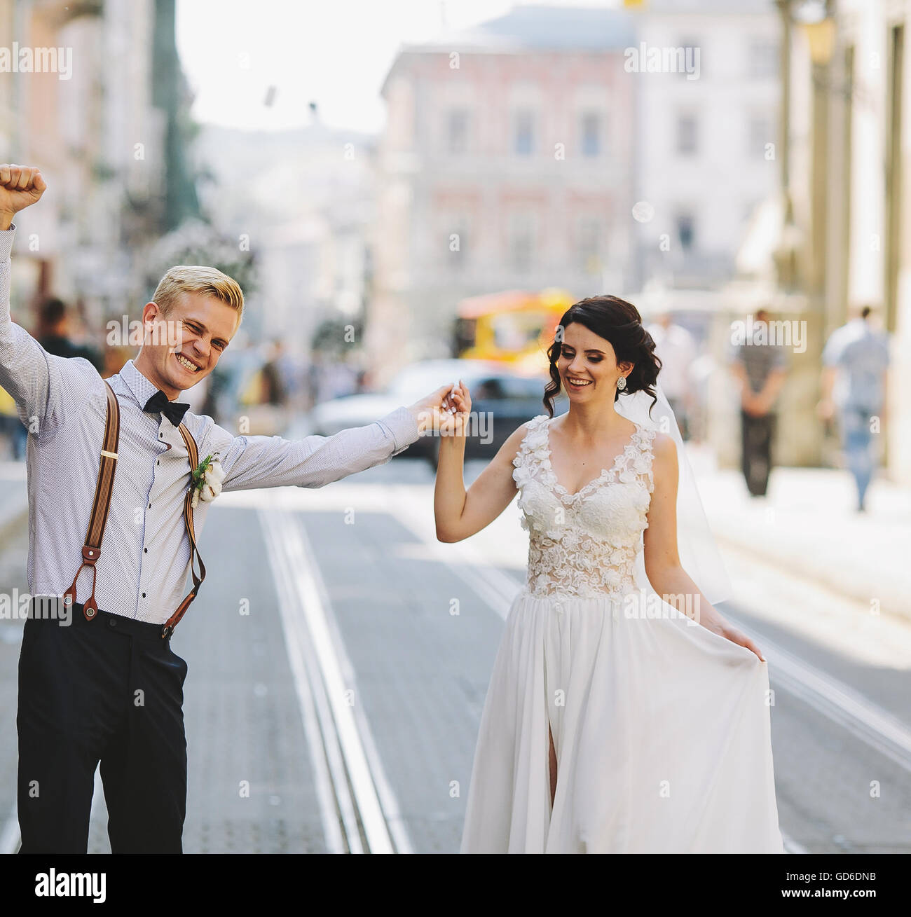 bride and groom on the street Stock Photo - Alamy