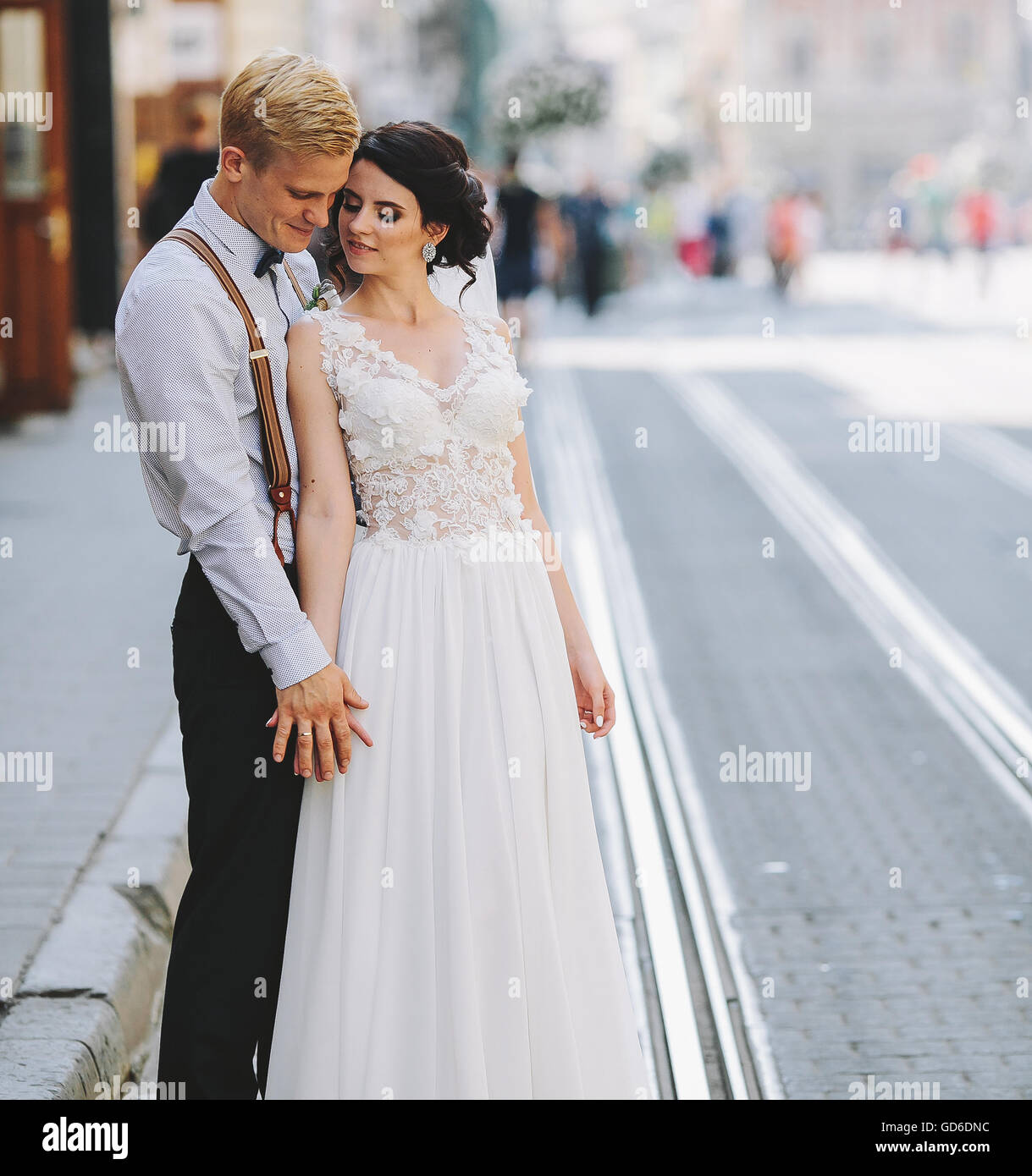 bride and groom on the street Stock Photo - Alamy