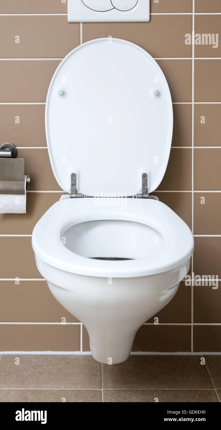 Modern white toilet bowl in the bathroom Stock Photo - Alamy