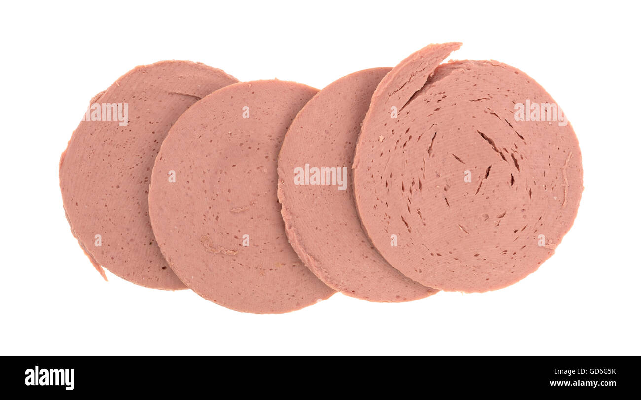 Several slices of chicken bologna in a row on a white background Stock Photo Alamy