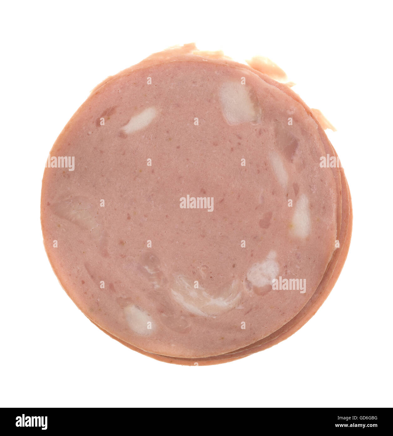 Top view of a stack of thin slices of mortadella luncheon meat isolated on a white background. Stock Photo