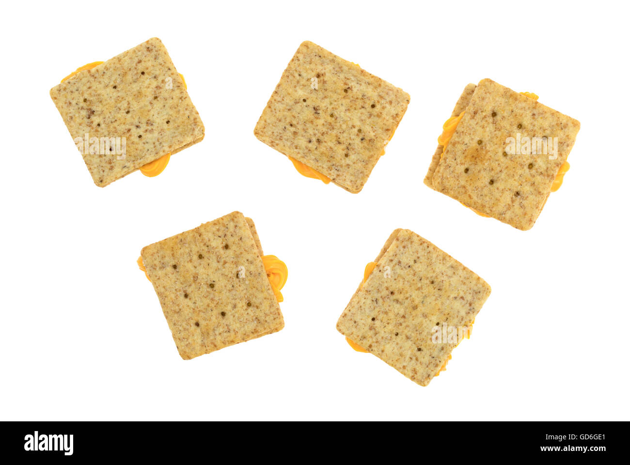 Organic whole wheat crackers with canned cheese between the crackers
