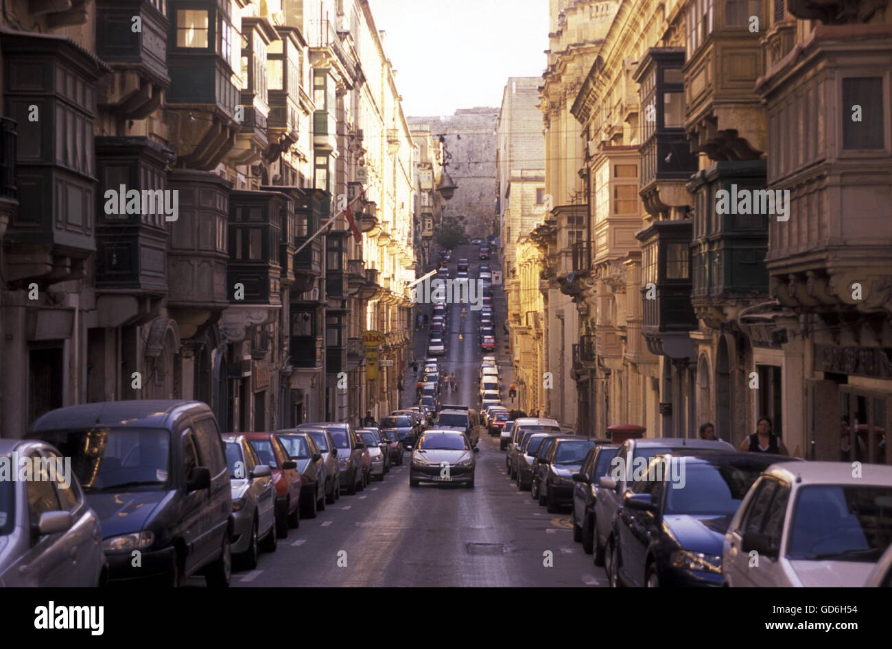 A smal road in the centre of the Old Town of the city of Valletta on the Island of Malta in the Mediterranean Sea in Europe. Stock Photo