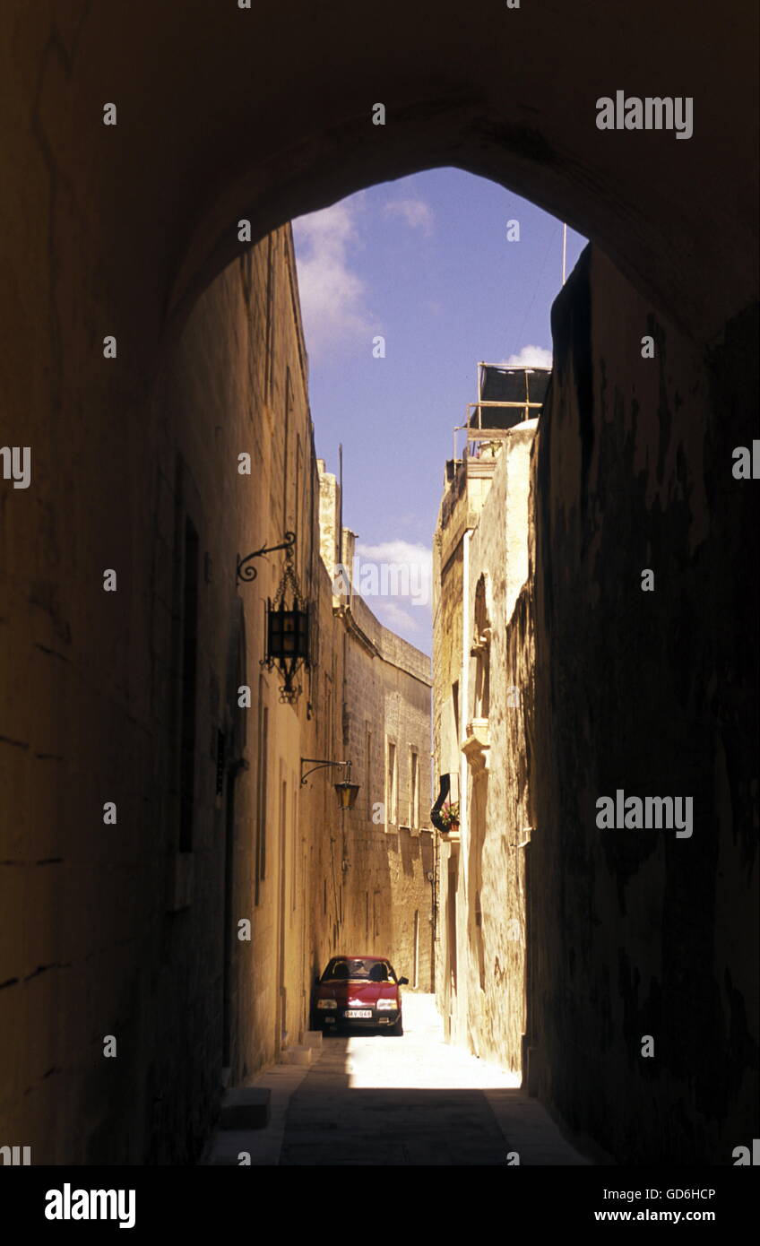 A smal road in the centre of the Old Town of the city of Valletta on the Island of Malta in the Mediterranean Sea in Europe. Stock Photo