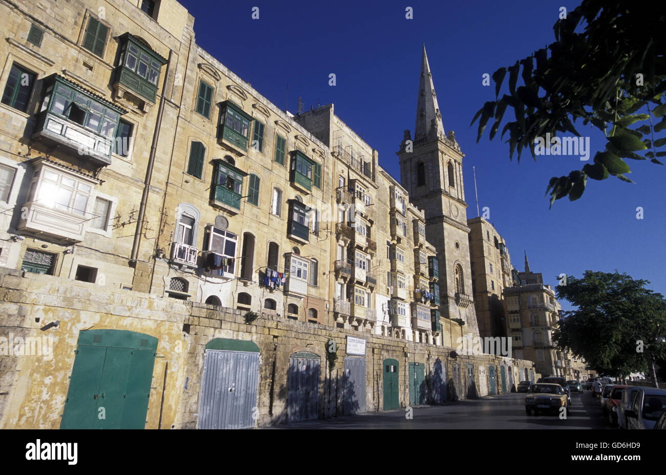 A smal road in the centre of the Old Town of the city of Valletta on the Island of Malta in the Mediterranean Sea in Europe. Stock Photo