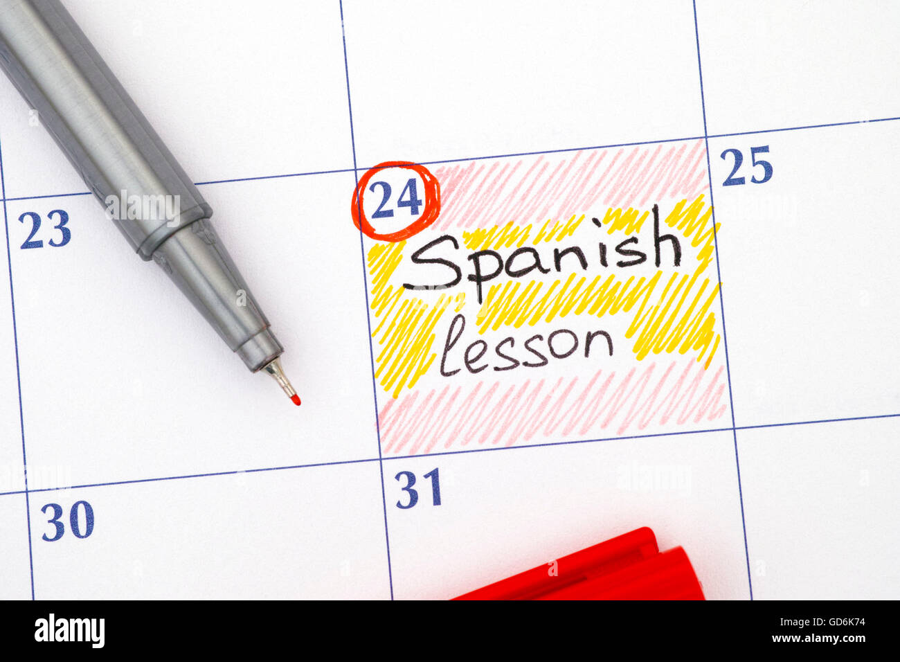 Reminder Spanish lesson in calendar with red pen Stock Photo Alamy