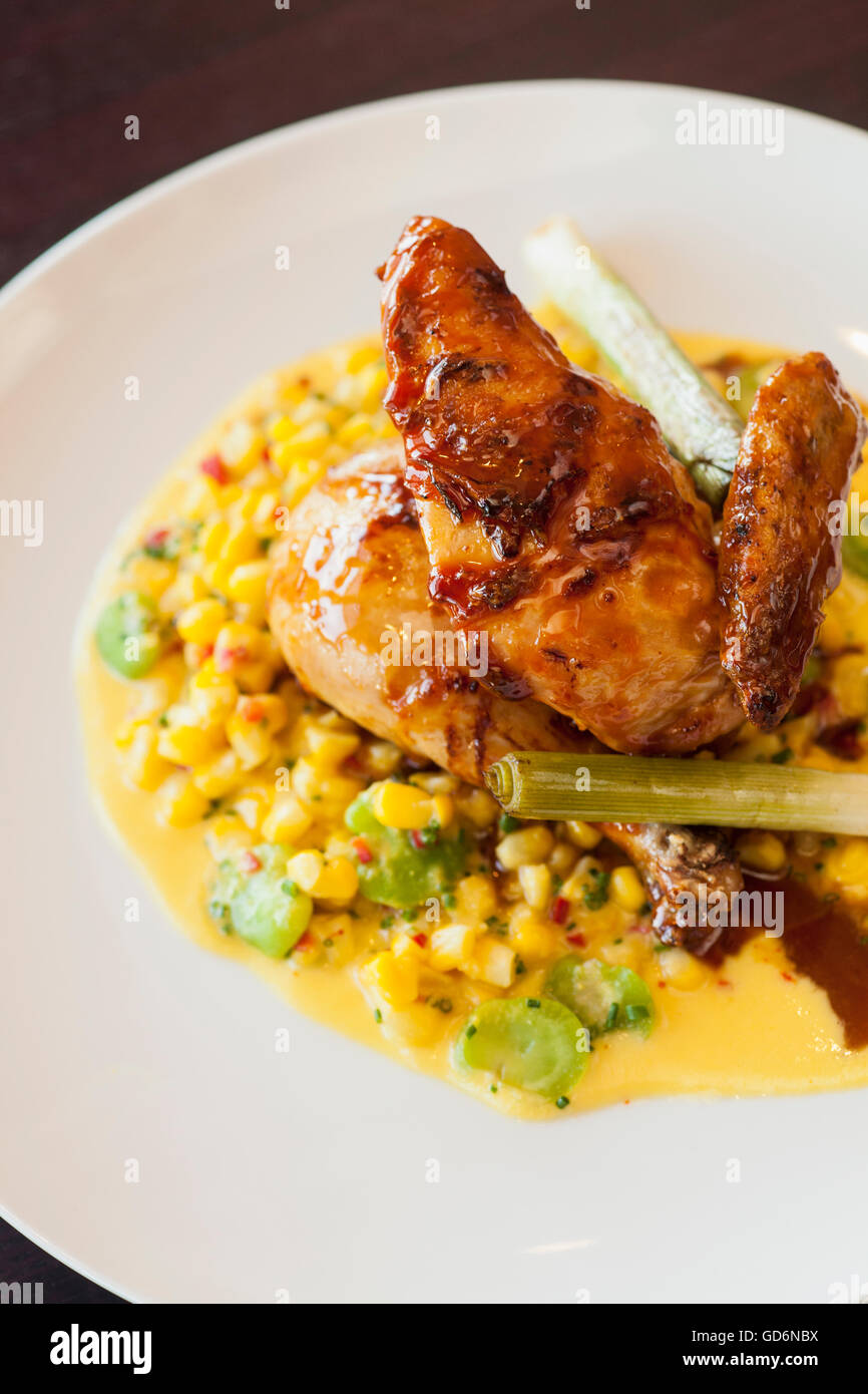half Mary's free range chicken over succotash, Nuance Restaurant, Santa Barbara, California Stock Photo