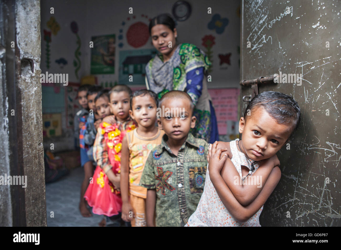 Urban Slum kids go to the Pre-school. Dhaka, Bangladesh. Seen here a students line up. Stock Photo