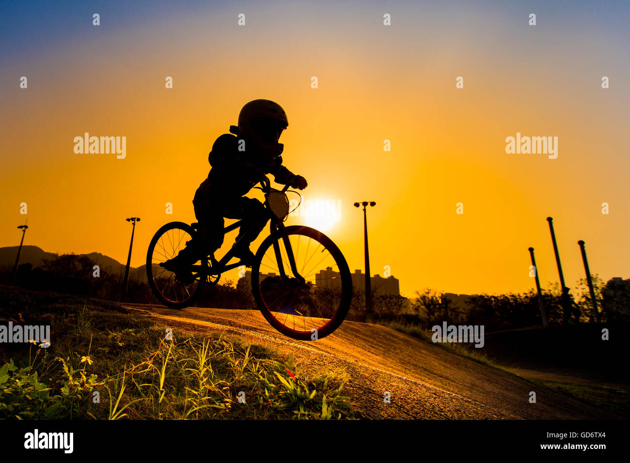 Silhouette Of Stunt Bmx Rider - color tone tuned Stock Photo