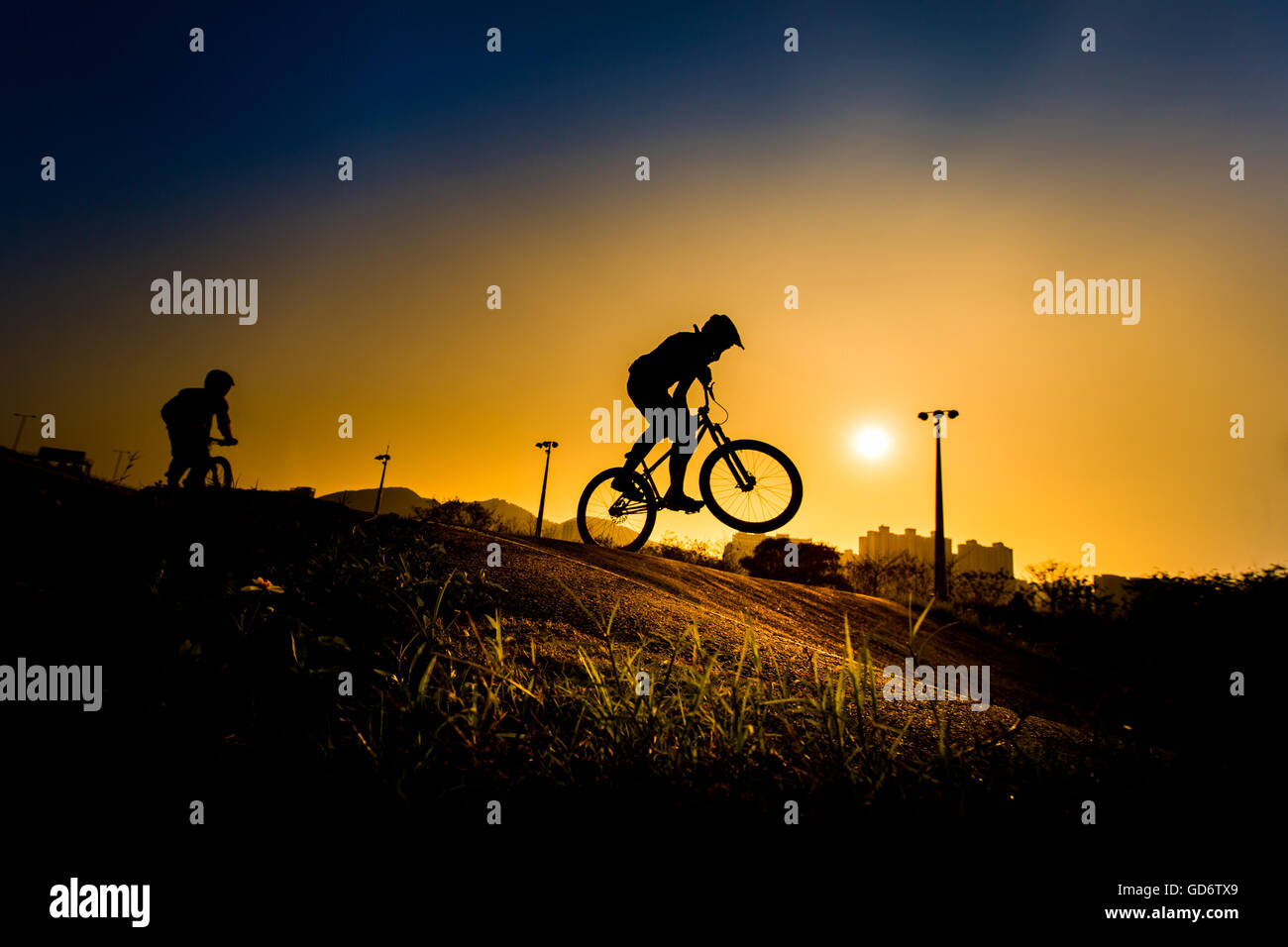 Silhouette Of Stunt Bmx Rider - color tone tuned Stock Photo