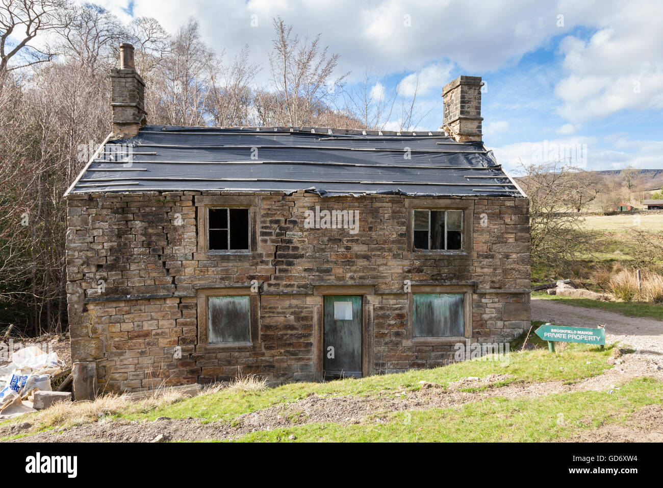 Derelict farm cottage under repair in the countryside. Derbyshire, Peak District, England, UK Stock Photo