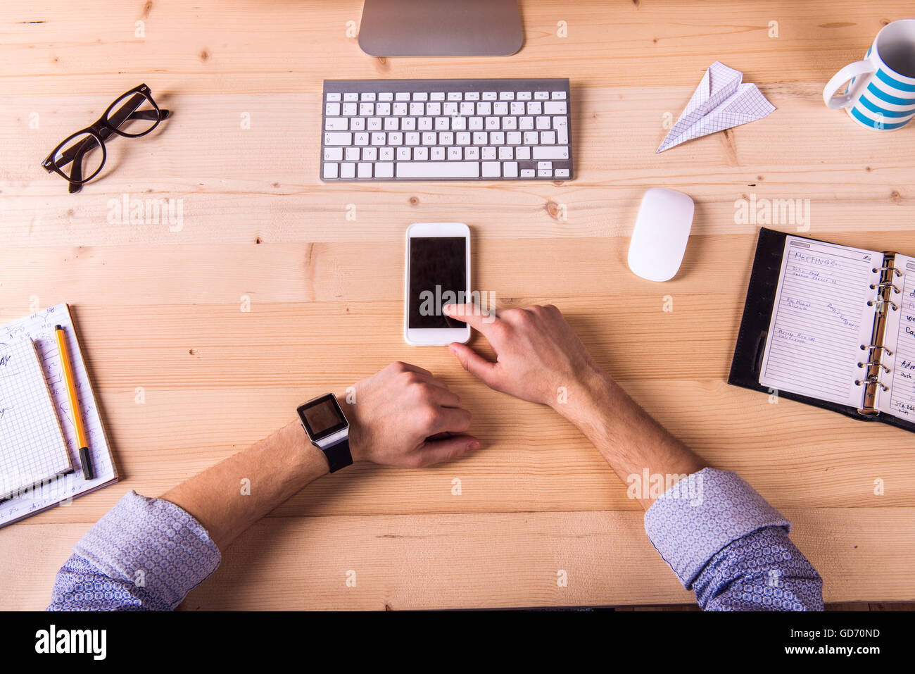 Businessman at the desk, office gadgets and supplies Stock Photo - Alamy