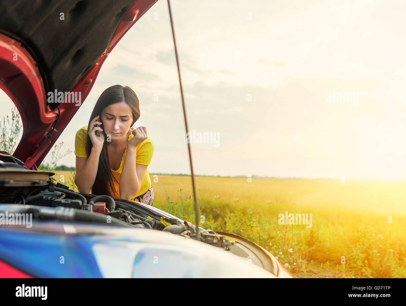 Woman calling emergency service near her broken car Stock Photo - Alamy