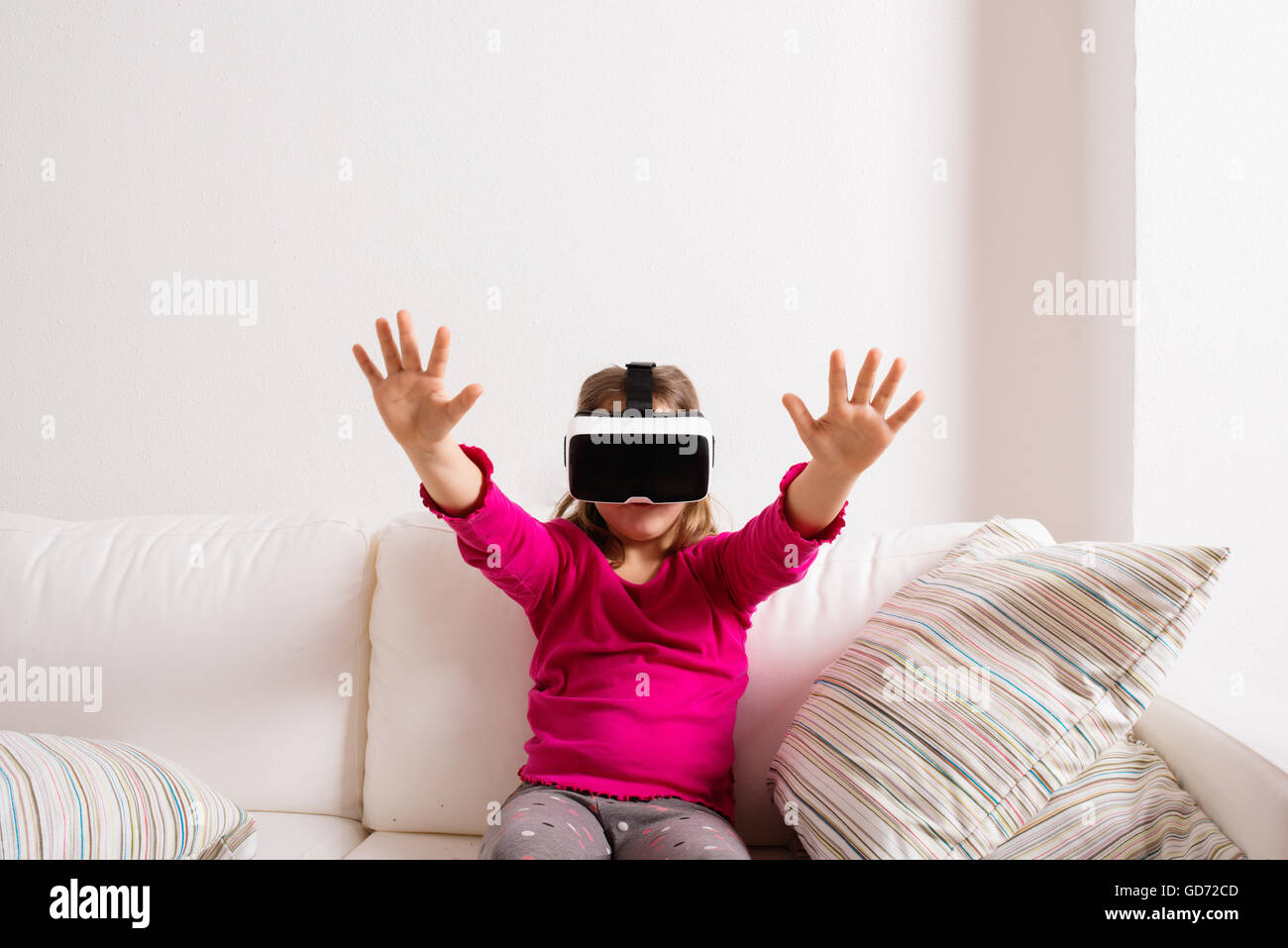 Girl wearing virtual reality goggles. Studio shot, copy space Stock Photo
