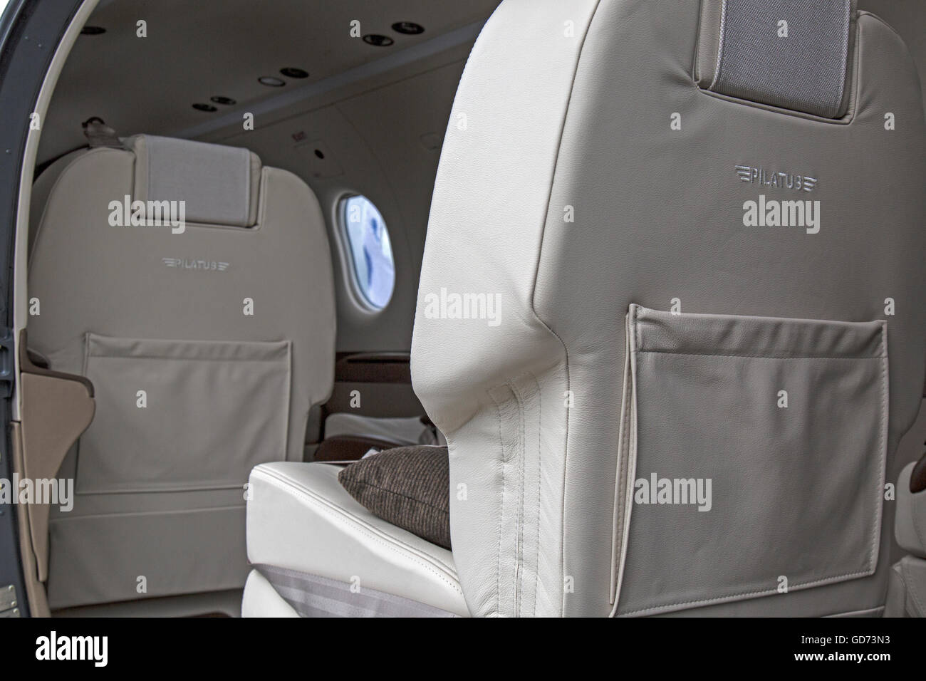 View of the interior of a Pilatus PC-12/47 executive airplane, showing seating. Stock Photo