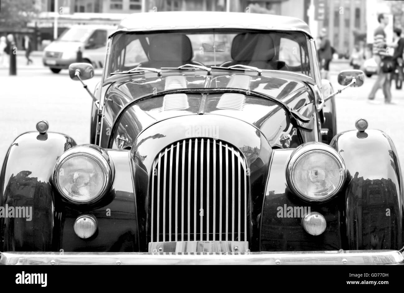 vintage oldstyle car in the city with defocused background Stock Photo