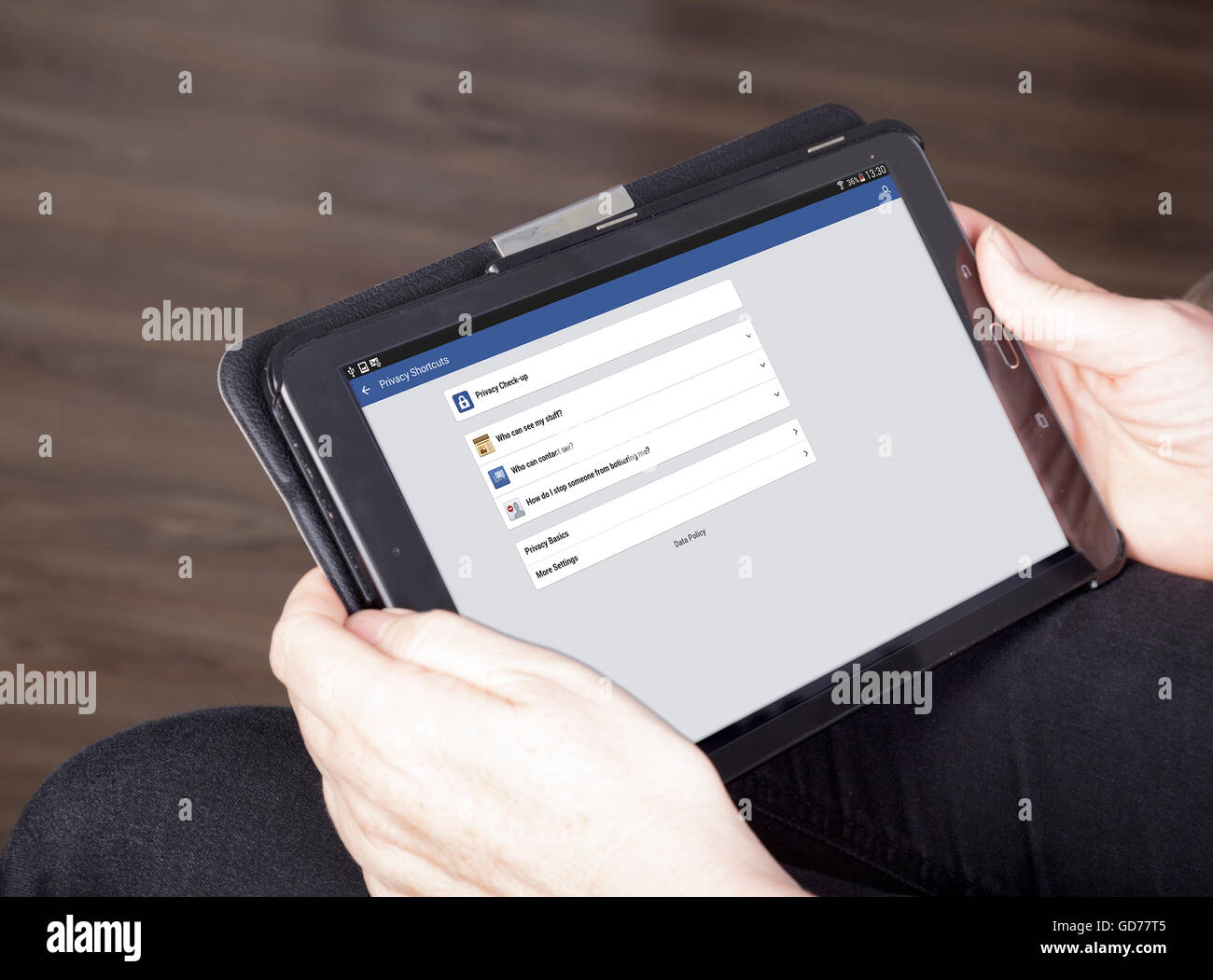 viewing Facebook privacy shortcuts on a tablet Stock Photo