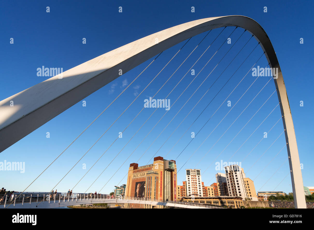 Gateshead's Millennium bridge frames the Baltic Centre for Contemporary Art and flats, Tyne and Wear, England, UK Stock Photo