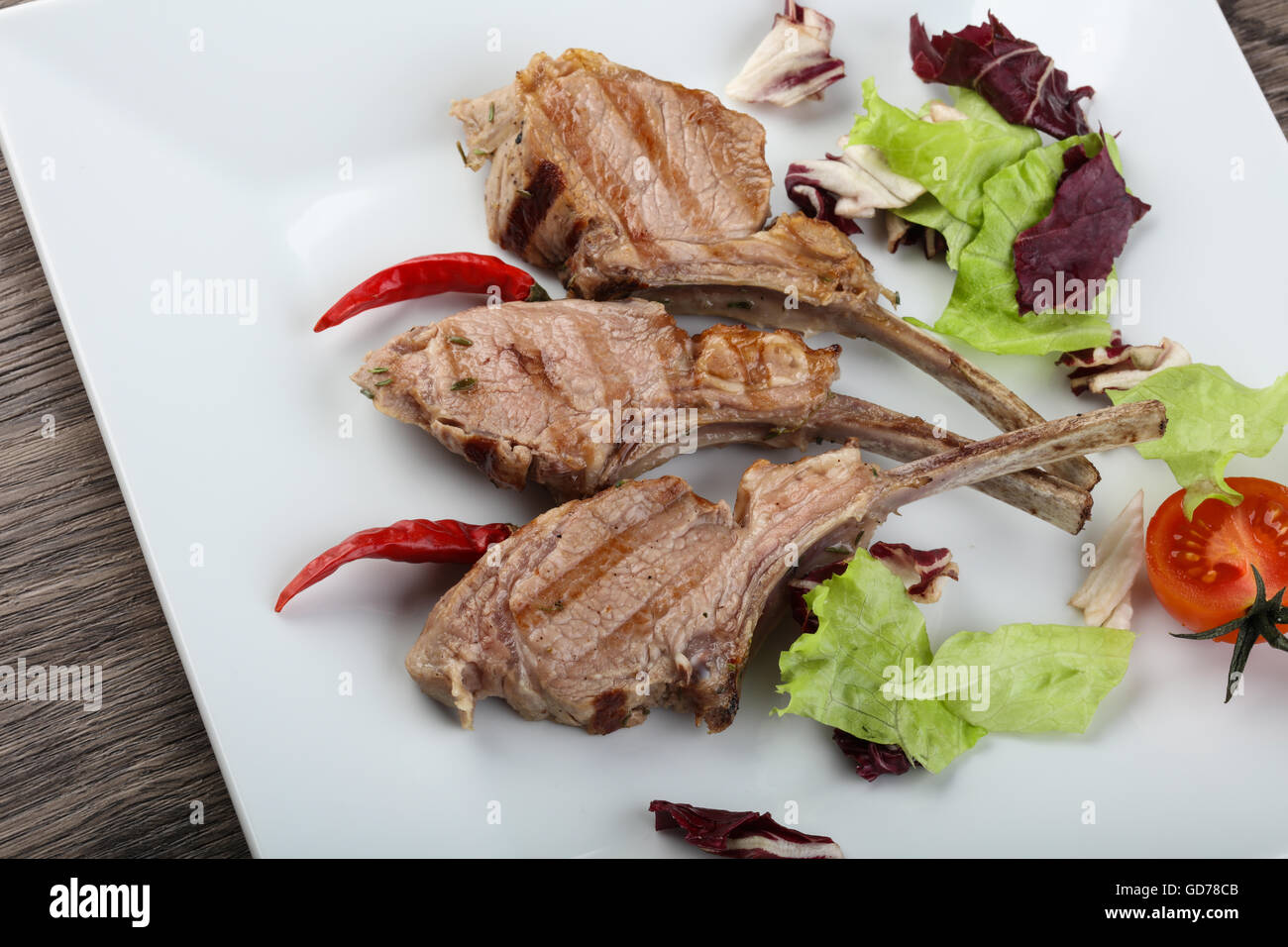 Lamb Frenched Rack grilled rib bone Stock Photo - Alamy
