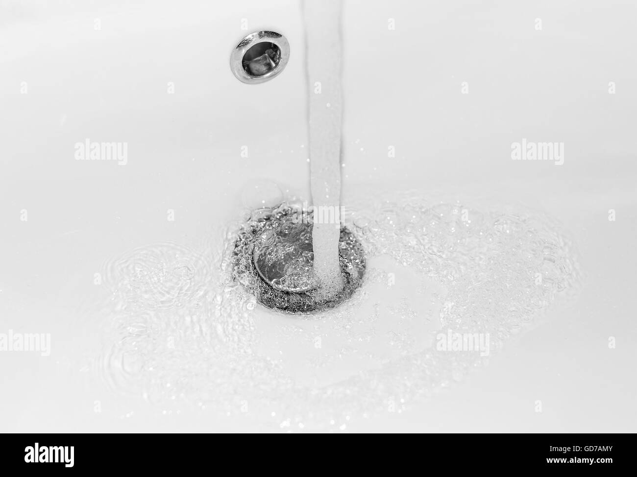 Clean water is flowing from the tap. Close-up. Stock Photo