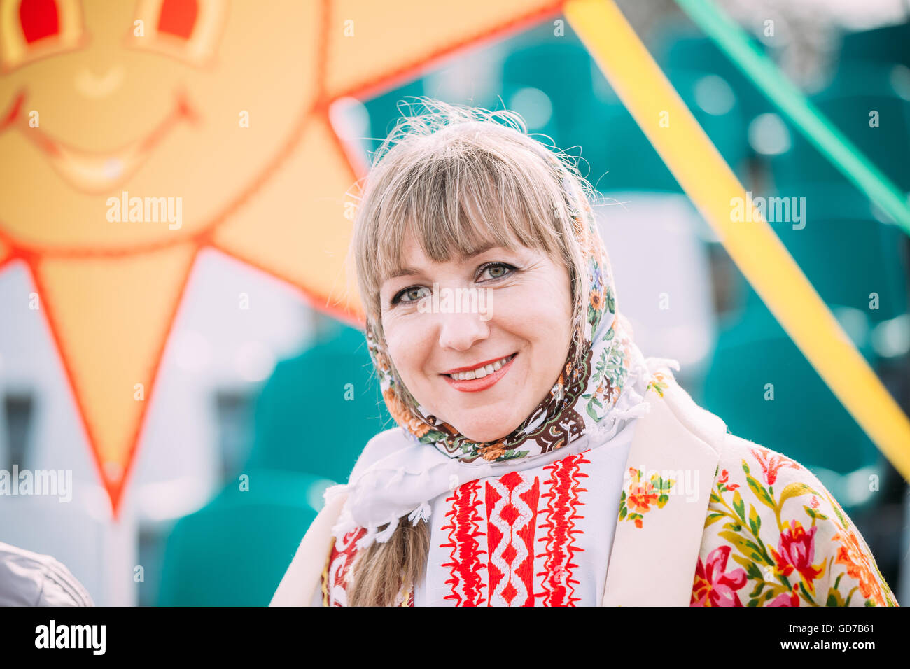 Gomel, Belarus - March 12, 2016: Close up of unknown beautiful young adult woman in national folk clothes at Celebration of Masl Stock Photo