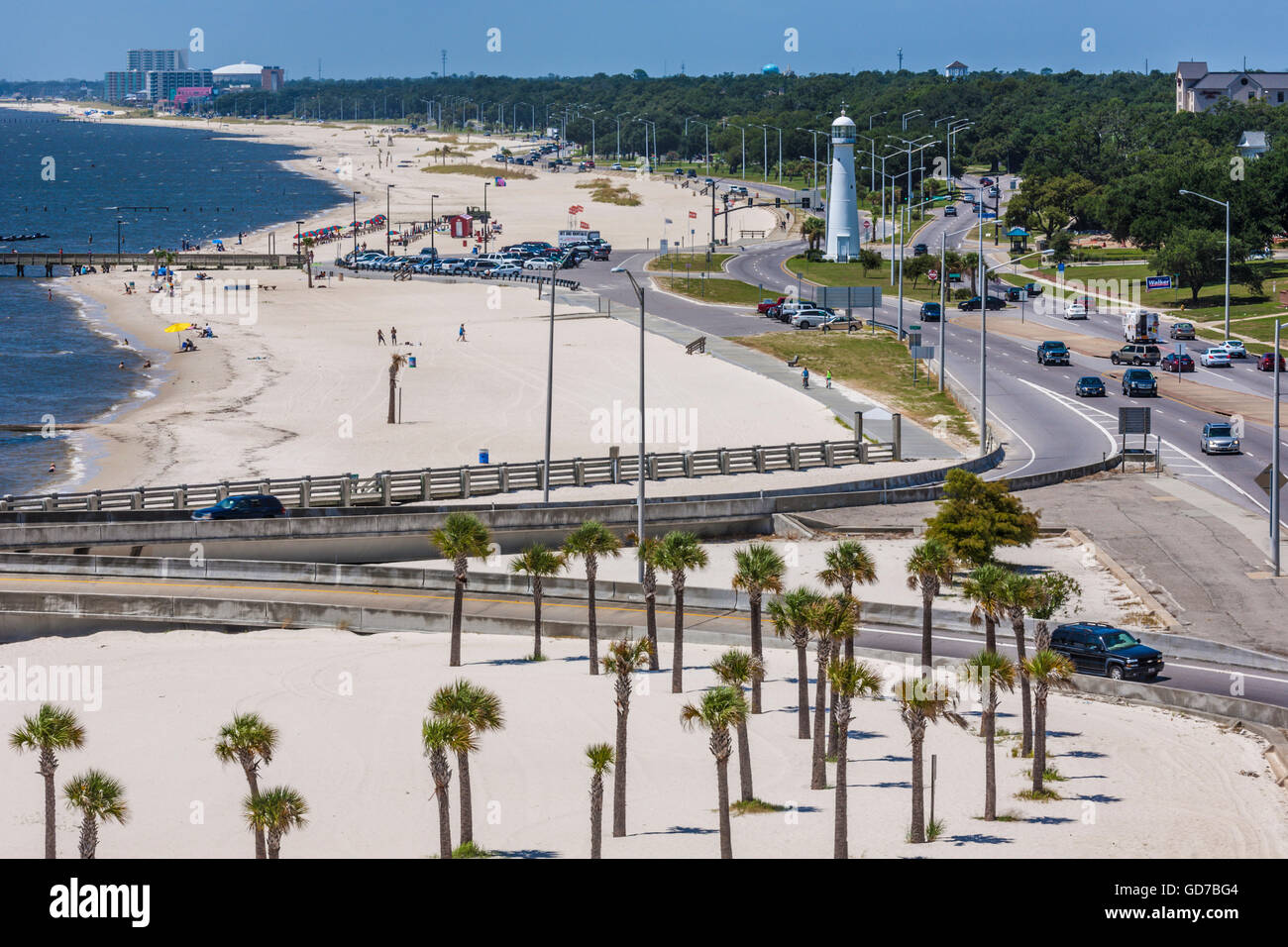 Low aerial view of the white sand beach and lighthouse along Highway 90 in Biloxi, Mississippi