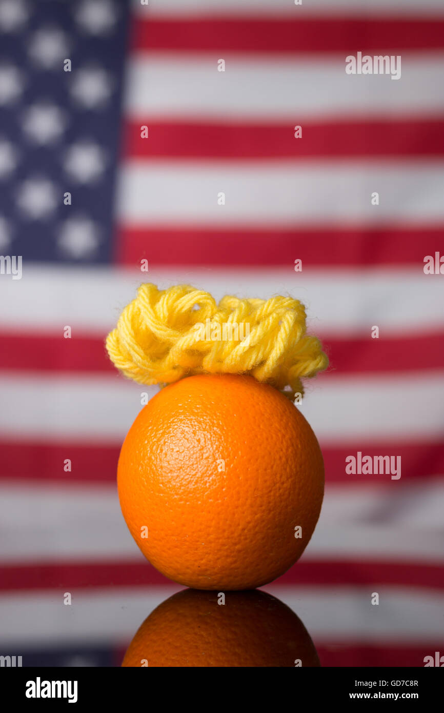 A satirical photo of an Orange made to look like US presidential candidate Donald Trump. Stock Photo