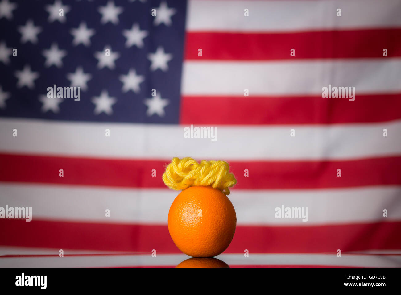 A satirical photo of an Orange made to look like US presidential candidate Donald Trump. Stock Photo