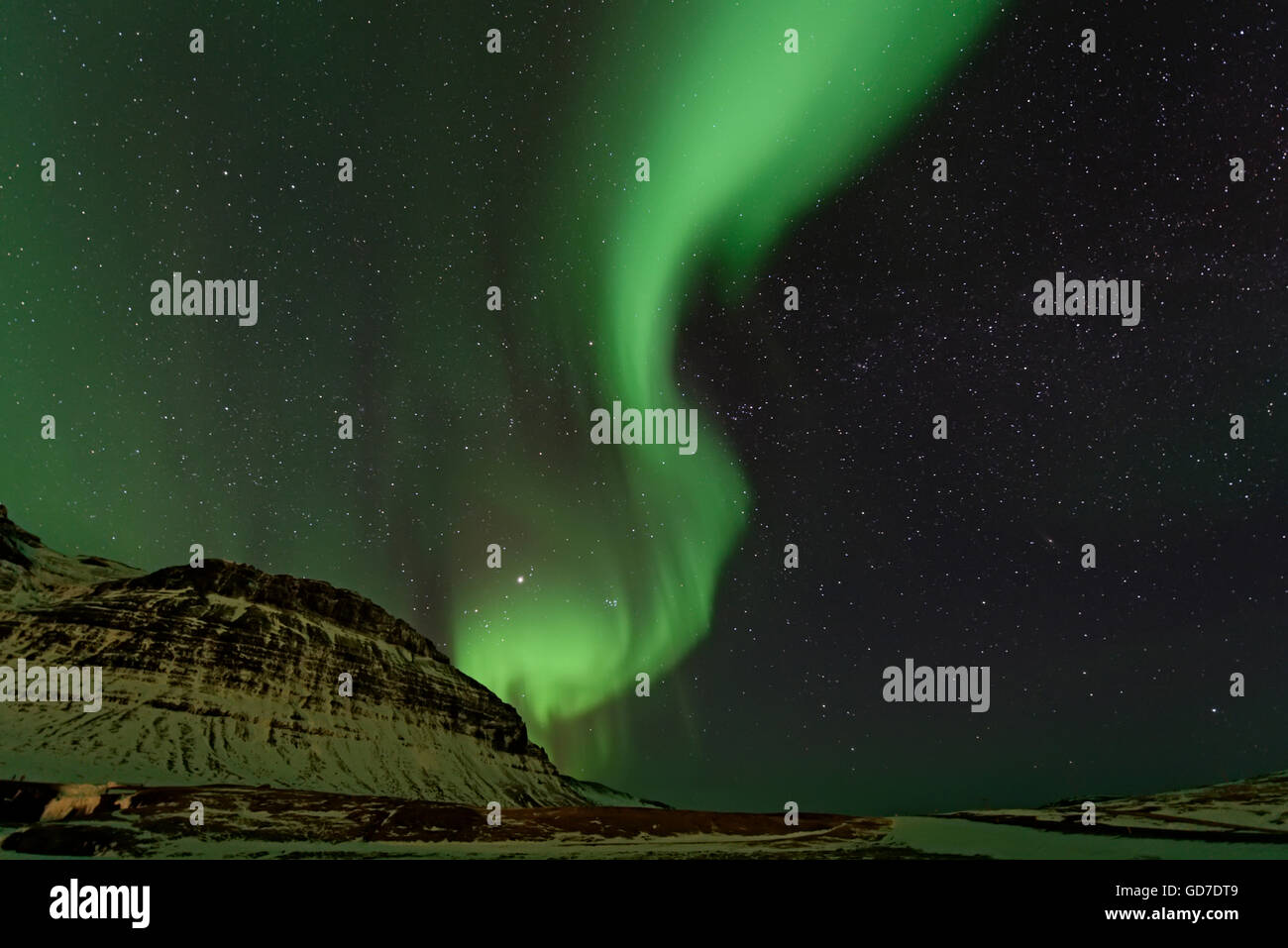 Aurora Borealis under a sky filled with stars, Grundarfjordur, Iceland Winter Stock Photo