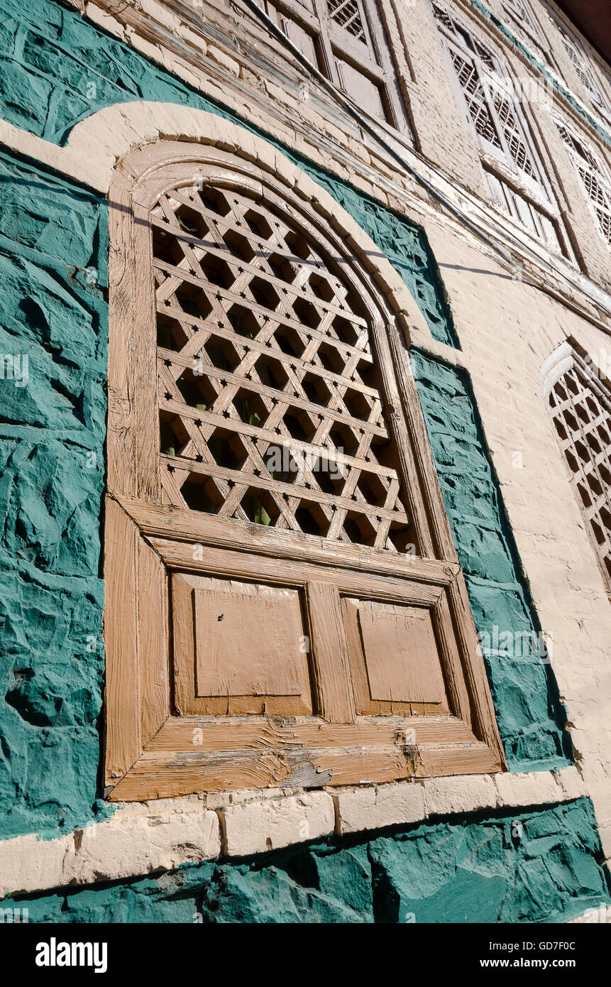 Wooden windows in old stone building, Srinagar, Jammu and Kashmir