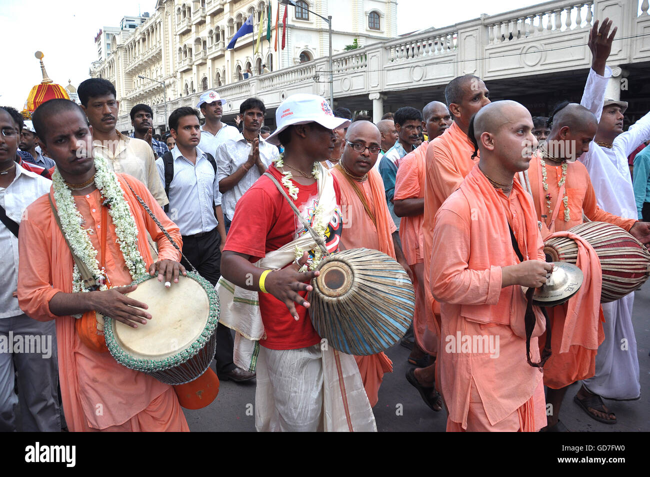 The Monks and Devotees of ISCON are sing devotional songs and walking with the Chariot of Lord Jaganath, Balaram & Mata Subhadra Stock Photo