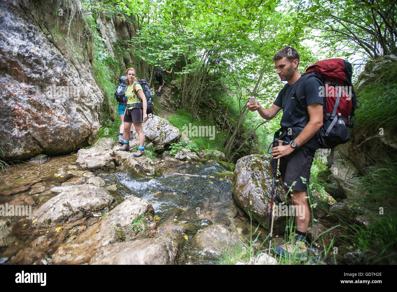 Hiking in Picos de Europe,Europa National Park,Spain.Waterfall near Bulnes village.Macizo Central Region,Asturias,Northern Spain Stock Photo