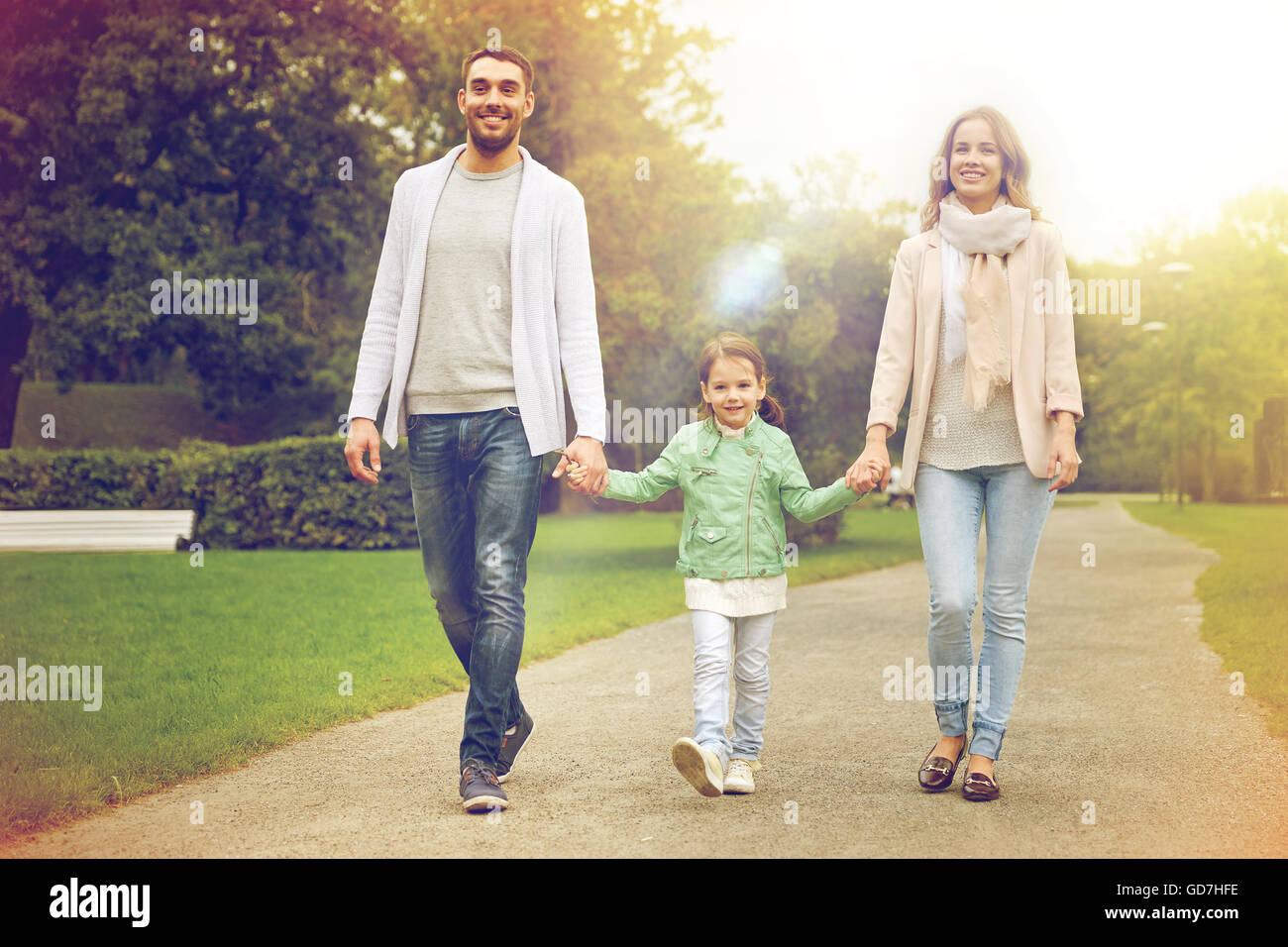 happy family walking in summer park Stock Photo - Alamy