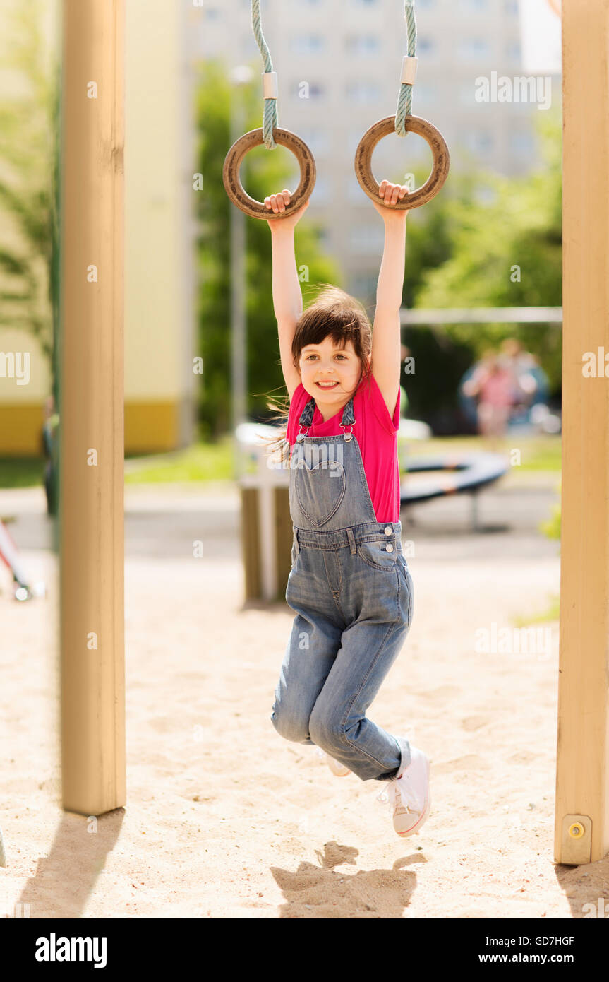 happy little girl on children playground Stock Photo - Alamy