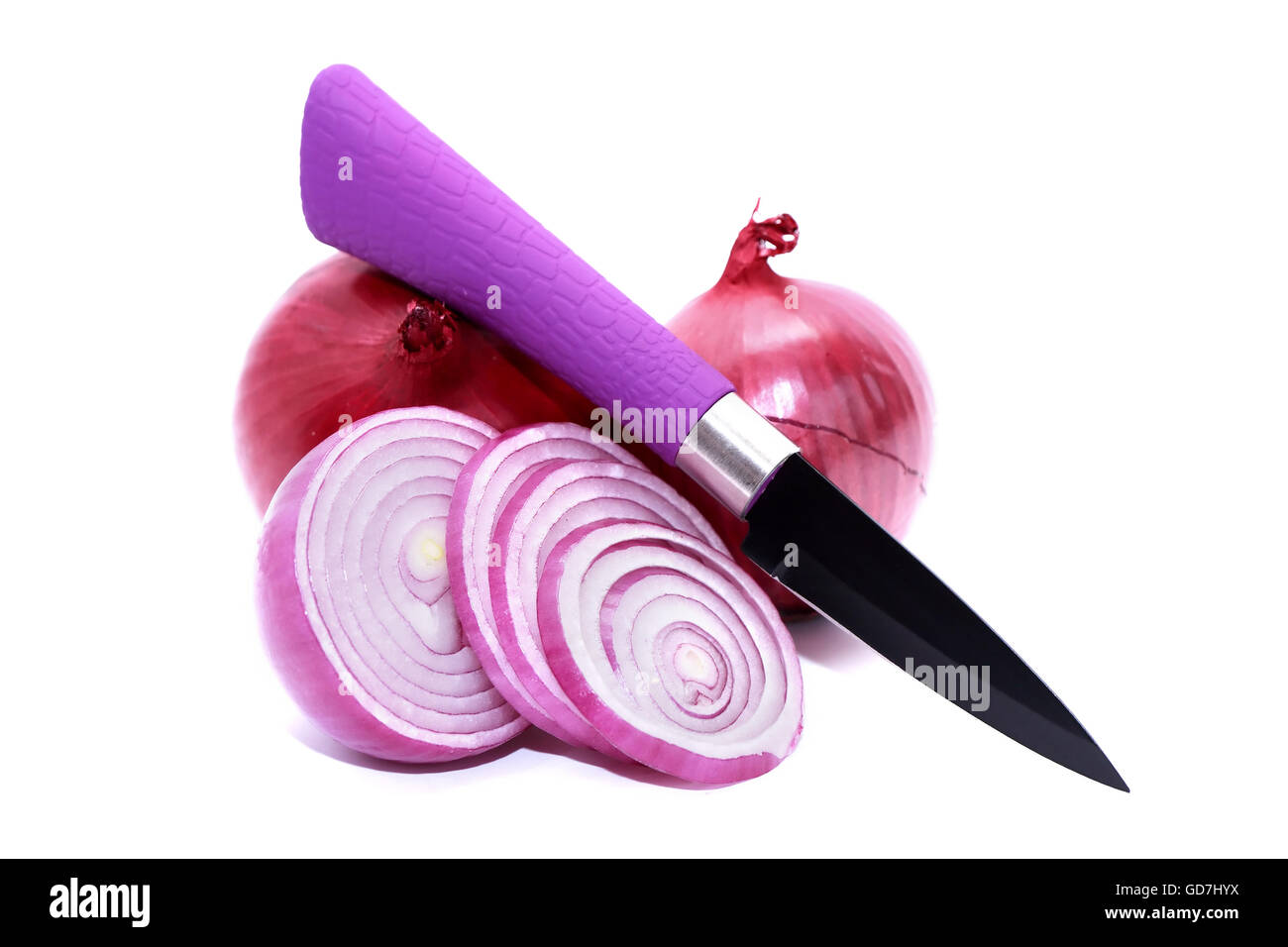 Red sliced onion and knife on white background Stock Photo - Alamy