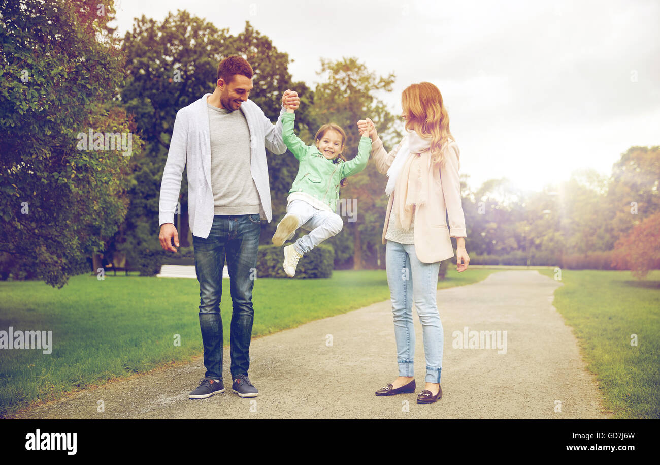 happy family walking in summer park and having fun Stock Photo - Alamy