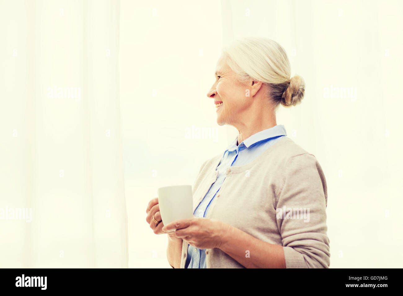happy senior woman with cup of tea or coffee Stock Photo - Alamy
