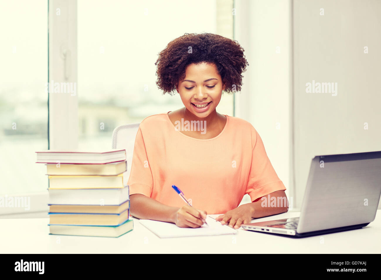 happy african american woman with laptop at home Stock Photo - Alamy
