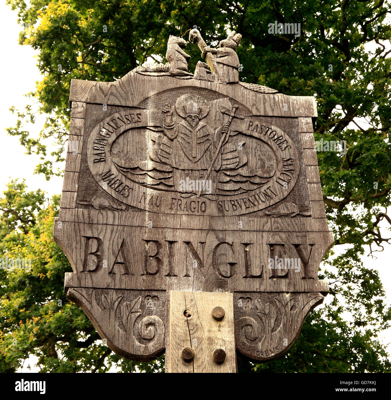 Babingley Village Sign, Norfolk, St. Felix of Burgundy and Beaver, Saint Saints signs England UK Stock Photo